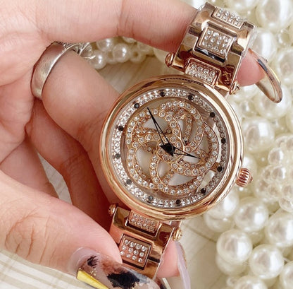Foreign trade hot style watch female steel watch lady quartz watch to turn the windmill surface douyin the same - GM Traders