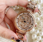 Foreign trade hot style watch female steel watch lady quartz watch to turn the windmill surface douyin the same - GM Traders